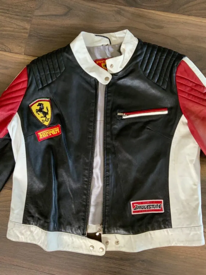 Front view of the black, white, and red leather Ferrari racing jacket with the prancing horse shield and Bridgestone patch.