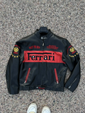 Front view of a black and red leather Michael Schumacher Ferrari F1 2004 World Champion jacket, with 