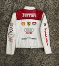 Back view of the white and red racing jacket, highlighting large Ferrari, Shell, Marlboro, and Audi sponsor logos.
