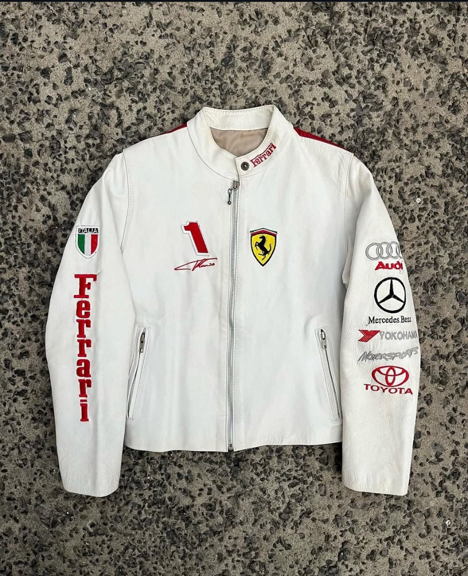Back view of the white and red racing jacket, highlighting large Ferrari, Shell, Marlboro, and Audi sponsor logos.